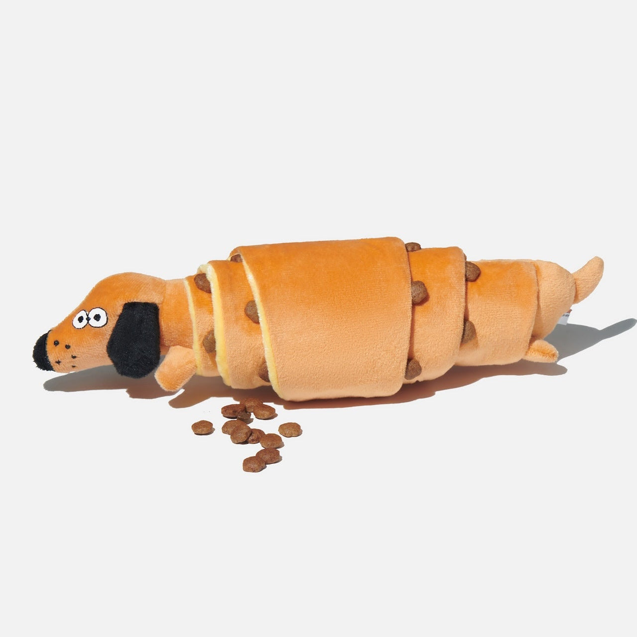Dog toy shaped like a hot dog on a white background